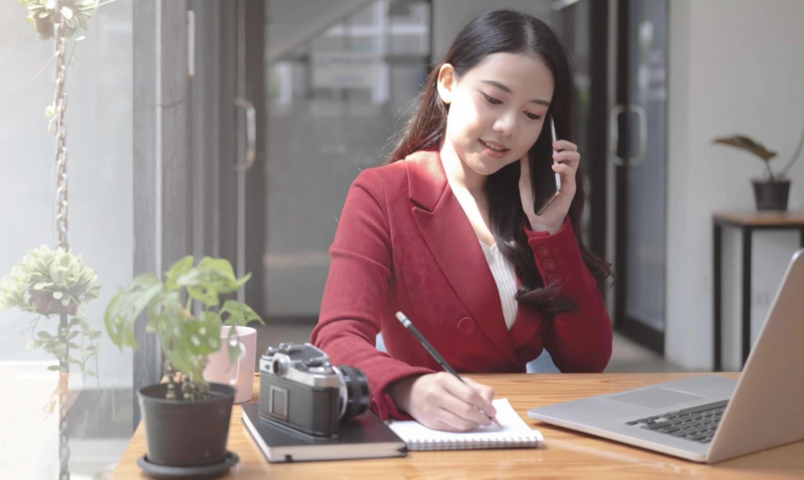 Person reviewing financial documents and planning budget at organized desk